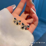 Black Crystal Pavé Bow Stud Earrings with Gold-Tone Frame for Women