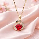 Swan crystal necklace on pink silk background
