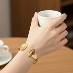 Sculptural Double Fin Cuff Bracelet – Gold-Toned Mirror Polish Open Bangle