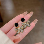 Crystal Bow Drop Earrings with Pearl Centre