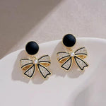 Crystal Bow Drop Earrings with Pearl Centre