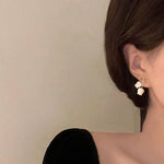 Ivory Tulip Bell Drop Earrings with Twisted Gold-Toned Bow